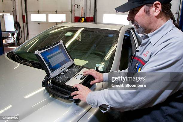 Dave Schuablin applies a firmware update to a recalled Toyota vehicle using a Panasonic Toughbook laptop at Caldwell Toyota in West Caldwell, New...