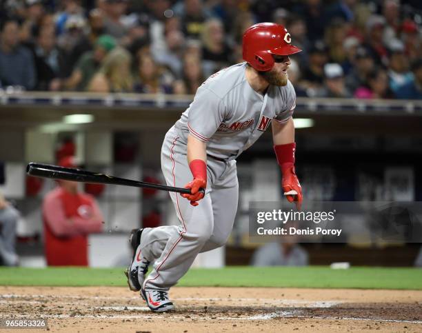 Tucker Barnhart of the Cincinnati Reds hits an RBI single during the fourth inning of a baseball game against the San Diego Padres at PETCO Park on...