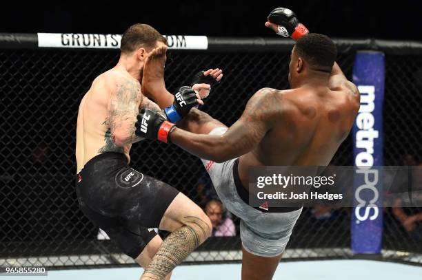 Walt Harris kicks Daniel Spitz in the face in their heavyweight fight during the UFC Fight Night event at the Adirondack Bank Center on June 1, 2018...