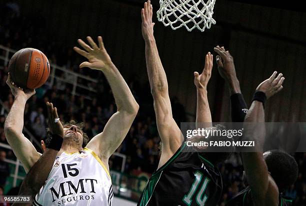 Real Madrid's Jorge Garbajosa tries to shoot the ball past Montepaschi's Tomas Ress and Romain Sato during their Top 16 Game 3, Groupe E, Euroleague...