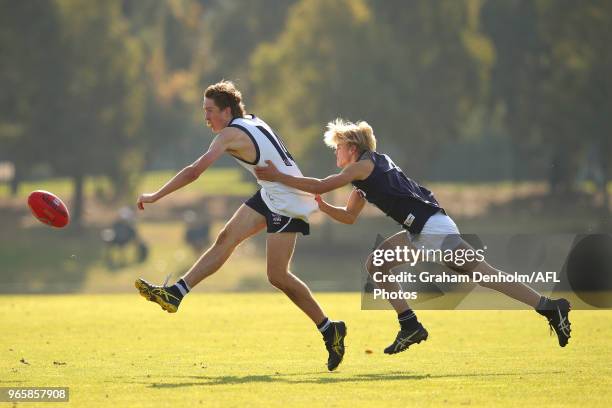 Charlie Brauer of Vic Country kicks under pressure during the trial match between U16 Vic Country and U16 Vic Metro at RAMS Arena on June 2, 2018 in...