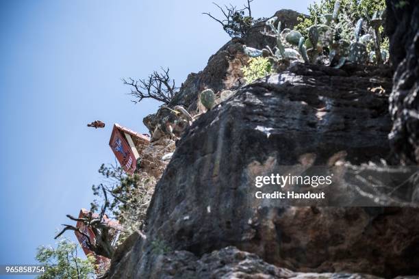 In this handout image provided by Red Bull, Kris Kolanus of Poland dives from the 27 metre platform during the first competition day of the first...