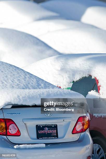 Toyota Corolla sedan is covered in snow on the dealership lot of Toyota Universe in Little Falls, New Jersey, U.S., on Thursday, Feb. 2010. Toyota...