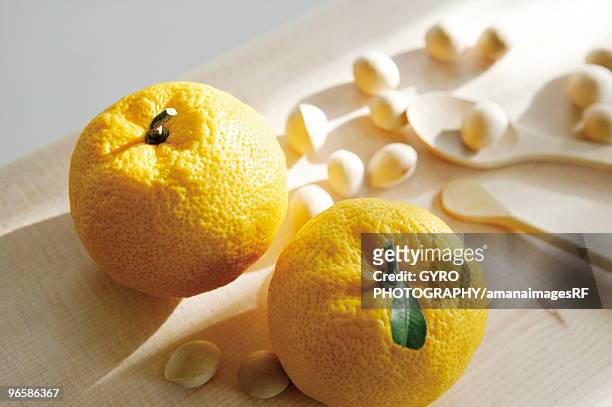 yuzu citron and nuts - yuzu stock pictures, royalty-free photos & images