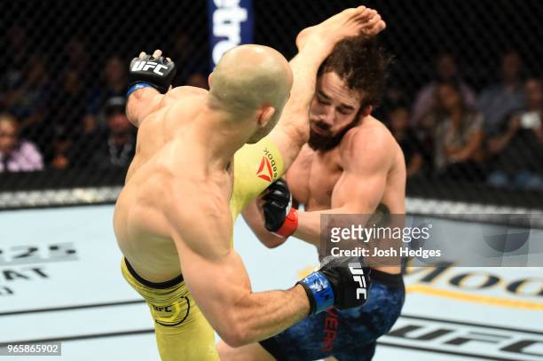 Marlon Moraes of Brazil kicks Jimmie Rivera in the head in their bantamweight fight during the UFC Fight Night event at the Adirondack Bank Center on...