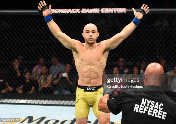 Marlon Moraes of Brazil celebrates after defeating Jimmie Rivera in their bantamweight fight during the UFC Fight Night event at the Adirondack Bank...