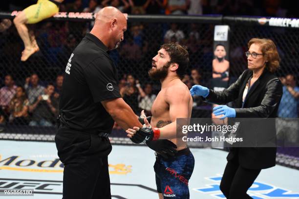 Jimmie Rivera reacts to referee Dan Miragliotta after Rivera was defeated by Marlon Moraes of Brazil in their bantamweight fight during the UFC Fight...