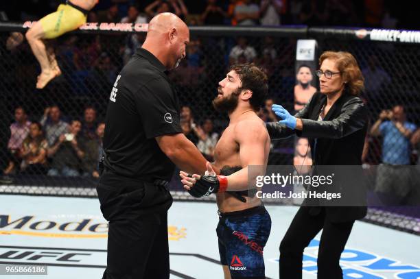 Jimmie Rivera reacts to referee Dan Miragliotta after Rivera was defeated by Marlon Moraes of Brazil in their bantamweight fight during the UFC Fight...