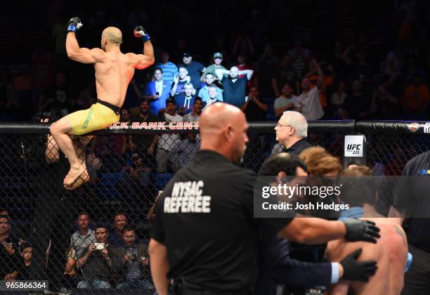 Marlon Moraes of Brazil celebrates after defeating Jimmie Rivera in their bantamweight fight during the UFC Fight Night event at the Adirondack Bank...