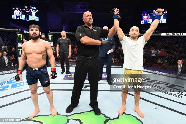 Marlon Moraes of Brazil celebrates after defeating Jimmie Rivera in their bantamweight fight during the UFC Fight Night event at the Adirondack Bank...