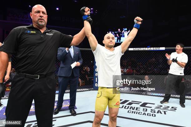 Marlon Moraes of Brazil celebrates after defeating Jimmie Rivera in their bantamweight fight during the UFC Fight Night event at the Adirondack Bank...