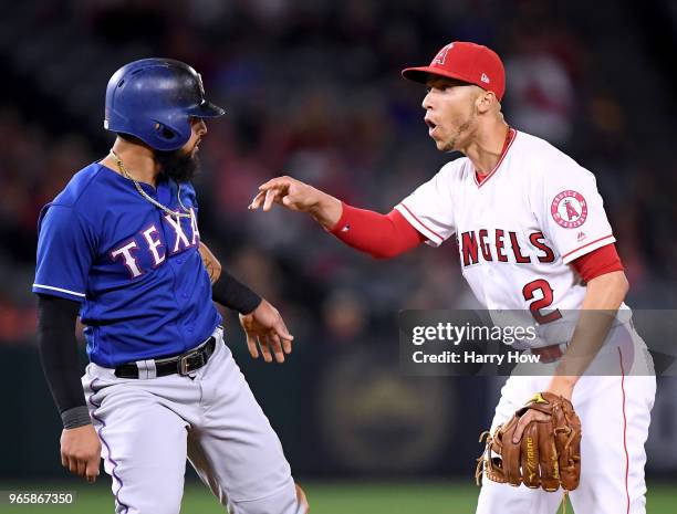 Andrelton Simmons of the Los Angeles Angels reacts to the slide of Rougned Odor of the Texas Rangers despite turning a double play to end the game...