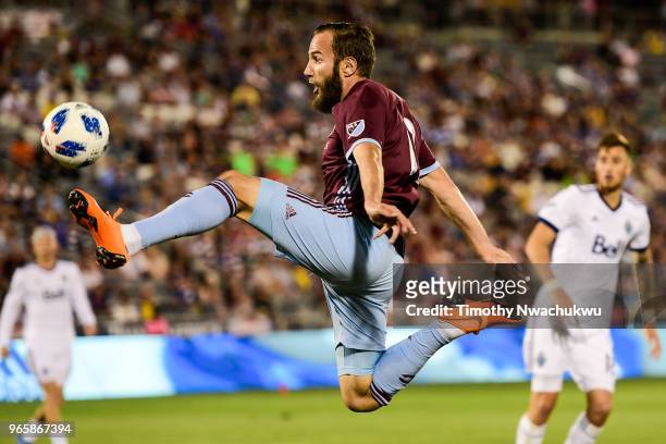 Nicolas Mezquida of Vancouver Whitecaps reaches for the ball against the Colorado Rapids at Dick's Sporting Goods Park on June 1, 2018 in Commerce...