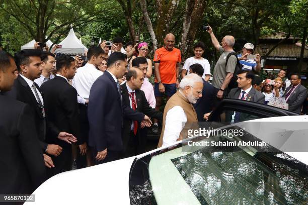 Indian Prime Minister Narendra Modi leaves after attending an orchid naming ceremony at the National Orchid Gardens on June 2, 2018 in Singapore....