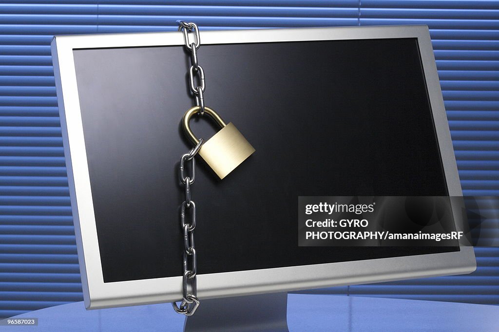 Padlock And Chain Around A Computer Monitor High-Res Stock Photo ...