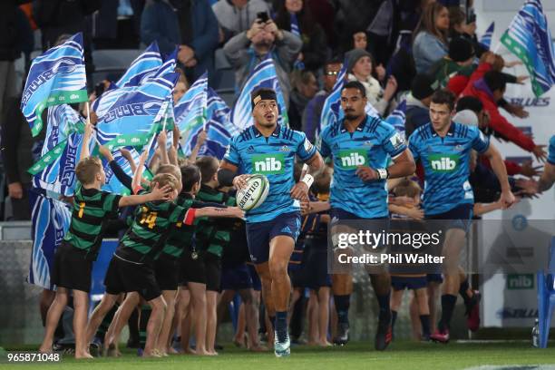 Augustine Pulu of the Blues leads the team out during the round 16 Super Rugby match between the Blues and the Rebels at Eden Park on June 2, 2018 in...