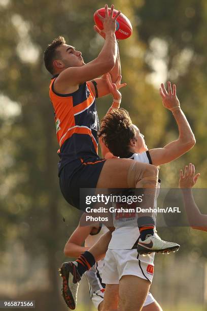 John Roumeliotis of the Calder Cannons takes a mark during the round eight TAC Cup match between the Calder Cannons and Greater Western Victoria...