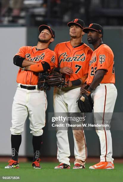 Gregor Blanco, Gorkys Hernandez and Andrew McCutchen of the San Francisco Giants celebrates defeating the Philadelphia Phillies 4-0 at AT&T Park on...