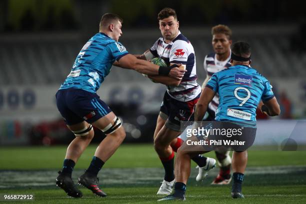 Tom English of the Rebels is tackled during the round 16 Super Rugby match between the Blues and the Rebels at Eden Park on June 2, 2018 in Auckland,...