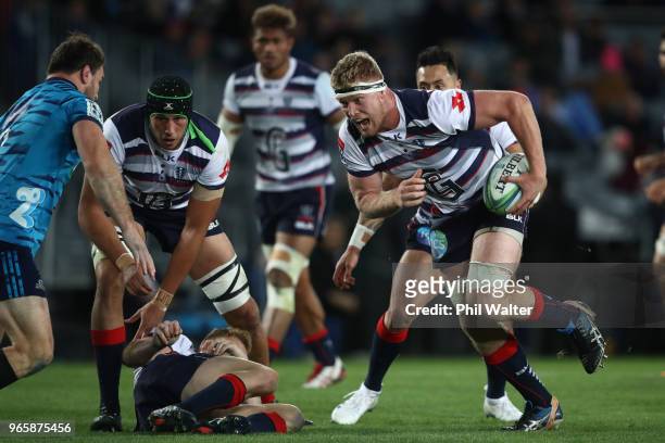 Matt Philip of the Rebels makes a break during the round 16 Super Rugby match between the Blues and the Rebels at Eden Park on June 2, 2018 in...
