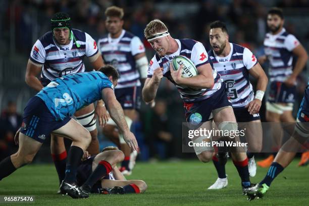 Matt Philip of the Rebels makes a break during the round 16 Super Rugby match between the Blues and the Rebels at Eden Park on June 2, 2018 in...