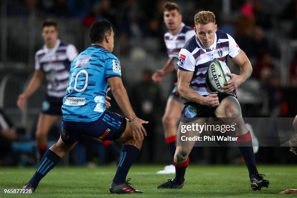 Reece Hodge of the Rebels looks for a gap during the round 16 Super Rugby match between the Blues and the Rebels at Eden Park on June 2, 2018 in...