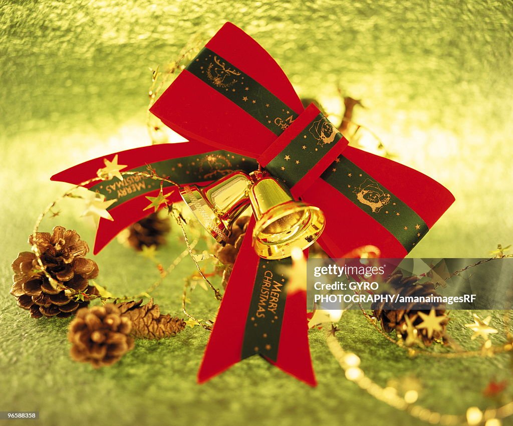 Christmas bow with decorative pine cones