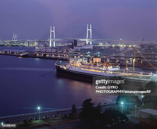 yokohama bay bridge and cruise ship, kanagawa prefecture, honshu, japan - yokohama bay bridge stock pictures, royalty-free photos & images