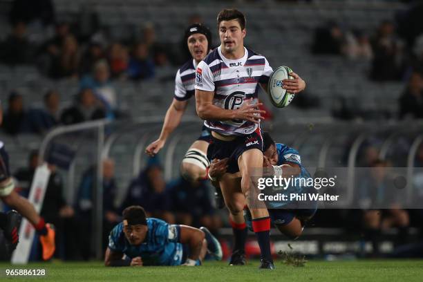 Jack Maddocks of the Rebels is tackled during the round 16 Super Rugby match between the Blues and the Rebels at Eden Park on June 2, 2018 in...