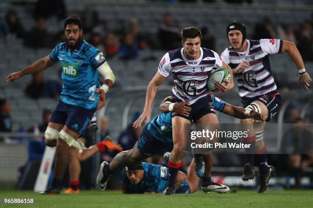 Jack Maddocks of the Rebels is tackled during the round 16 Super Rugby match between the Blues and the Rebels at Eden Park on June 2, 2018 in...