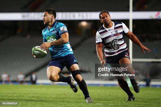Terrence Hepetema of the Blues runs in to score a try during the round 16 Super Rugby match between the Blues and the Rebels at Eden Park on June 2,...