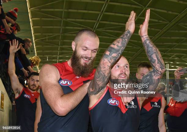 Max Gawn and Nathan Jones of the Demons celebrate winning the round 11 AFL match between the Western Bulldogs and the Melbourne Demons at Etihad...