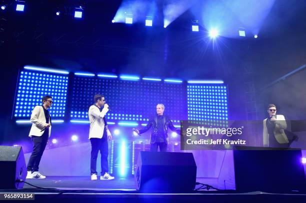 Jorma Taccone, Andy Samberg, Michael Bolton and Akiva Schaffer perform with The Lonely Island on the Colossal Stage during Clusterfest at Civic...