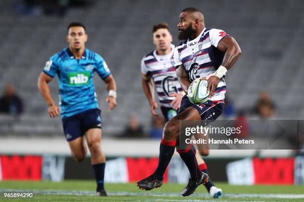 Marika Koroibete of the Rebels makes a break during the round 16 Super Rugby match between the Blues and the Rebels at Eden Park on June 2, 2018 in...