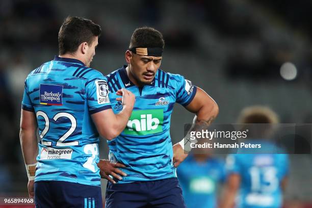Bryn Gatland of the Blues talks to Augustine Pulu of the Blues during the round 16 Super Rugby match between the Blues and the Rebels at Eden Park on...