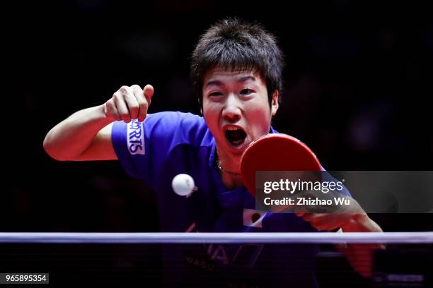 Mizutani Jun of Japan in action at the men's singles quarter-final compete with Lin Gaoyuan of China during the 2018 ITTF World Tour China Open on...