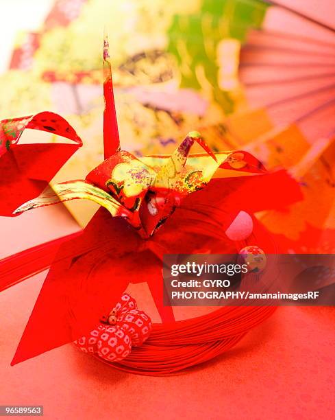 a folded paper crane, mizuhiki, and a fan - mizuhiki stock pictures, royalty-free photos & images