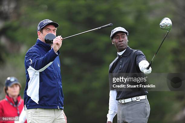 Huey Lewis and Don Cheadle during round one of the AT&T Pebble Beach National Pro-Am at Monterey Peninsula Country Club Shore Course on February 11,...