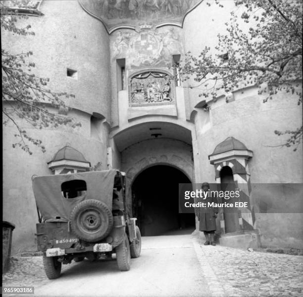 Soldier of the 1st French Army standing guard at the entrance to the Hohenzollern Castle in Sigmaringen on April 23, 1945. What remained of the Vichy...