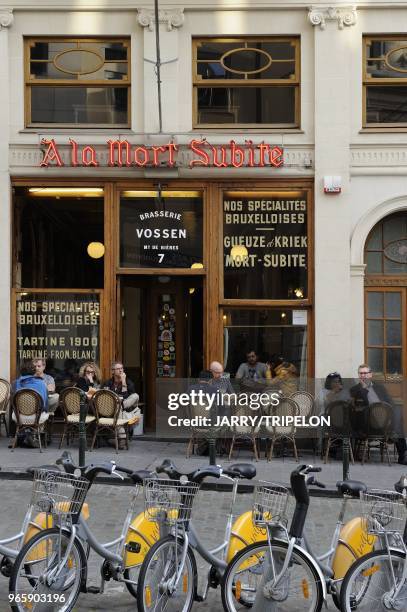 Bike to rent and A La Mort Subite bar on Montagne aux Herbes street, district centre called the Pentagon, city of Brussels, Brussels-Capital Region,...