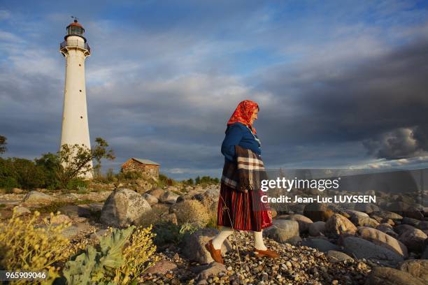 Elvi Vesik is walking by the lighthouse to the south of Kihnu Island. The particularity of this community is that women have remained on the islands...