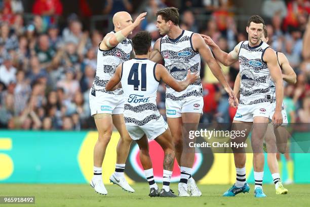 Tom Hawkins of the Cats celebrates a goal during the round 11 AFL match between the Gold Coast Suns and the Geelong Cats at Metricon Stadium on June...