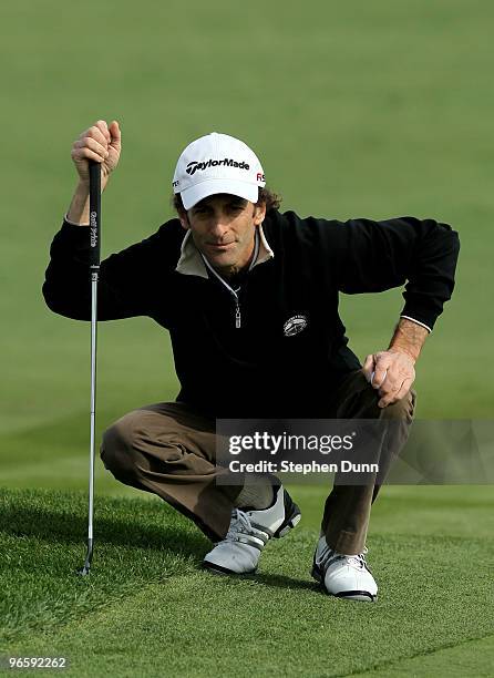 Musician Kenny G lines up a putt on the sixth hole during the first round of the AT&T Pebble Beach National Pro-Am at Pebble Beach Golf Links on...