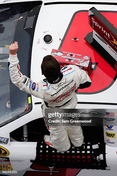 Kasey Kahne, driver of the Budweiser Ford, celebrates winning the second NASCAR Sprint Cup Series Gatorade Duel at Daytona International Speedway on...