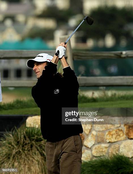 Musician Kenny G hits his tee shot on the seventh hole during the first round of the AT&T Pebble Beach National Pro-Am at Pebble Beach Golf Links on...