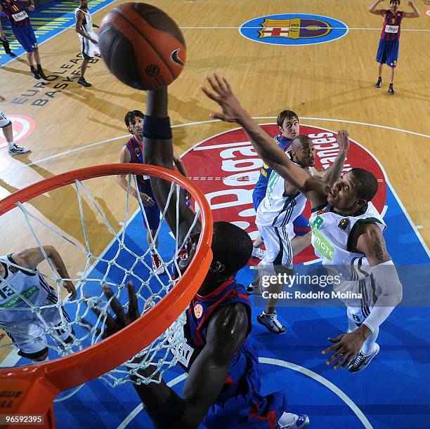 Boniface Ndong, #21 of Regal FC Barcelona competes with Mike Batiste, #8 of Panathinaikos Athens during the Euroleague Basketball 2009-2010 Last 16...