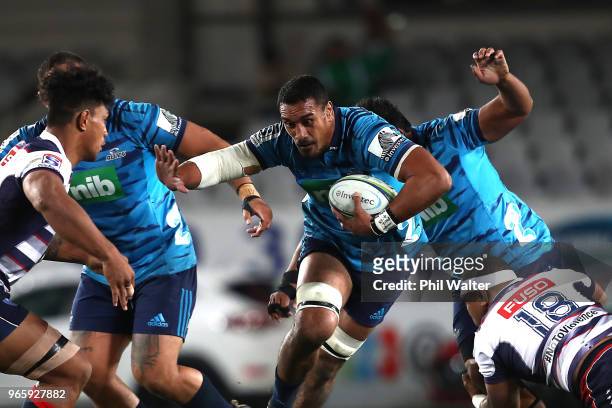 Jerome Kaino of the Blues is tackled during the round 16 Super Rugby match between the Blues and the Rebels at Eden Park on June 2, 2018 in Auckland,...