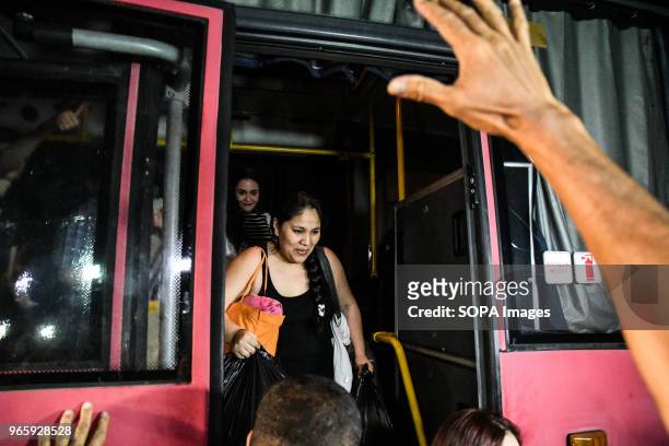 Political prisoner seen getting off a bus. Political prisoners reunite with relatives after being released from prison with conditional measures by...