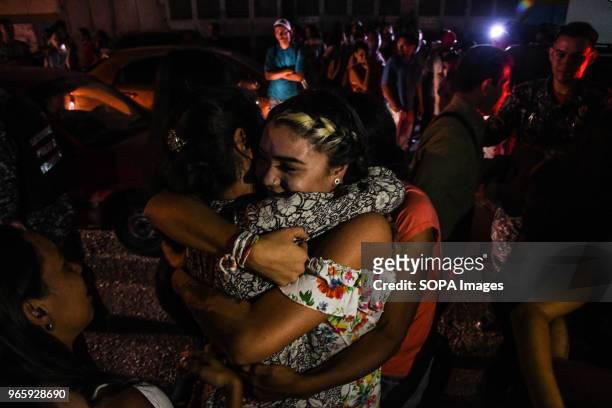 Women seen hugging each other after one of them has been released from prison. Political prisoners reunite with relatives after being released from...