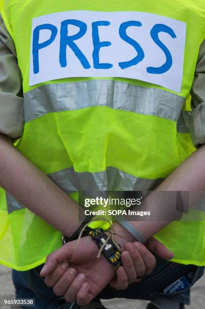 Man with a jacket saying "PRESS" attend a protest demanding the release of the Ukrainian filmmaker and writer,Oleg Sentsov at the Main Square in...